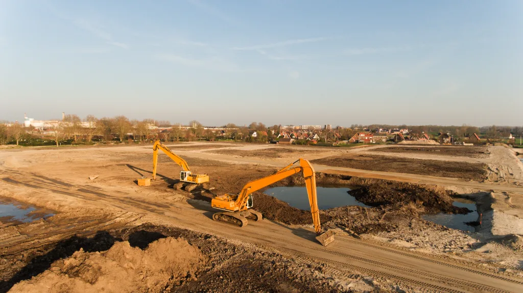 A high angle shot of two excavators on a building site